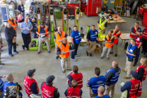 Police, Fire, and training personnel debrief after an active shooter exercise